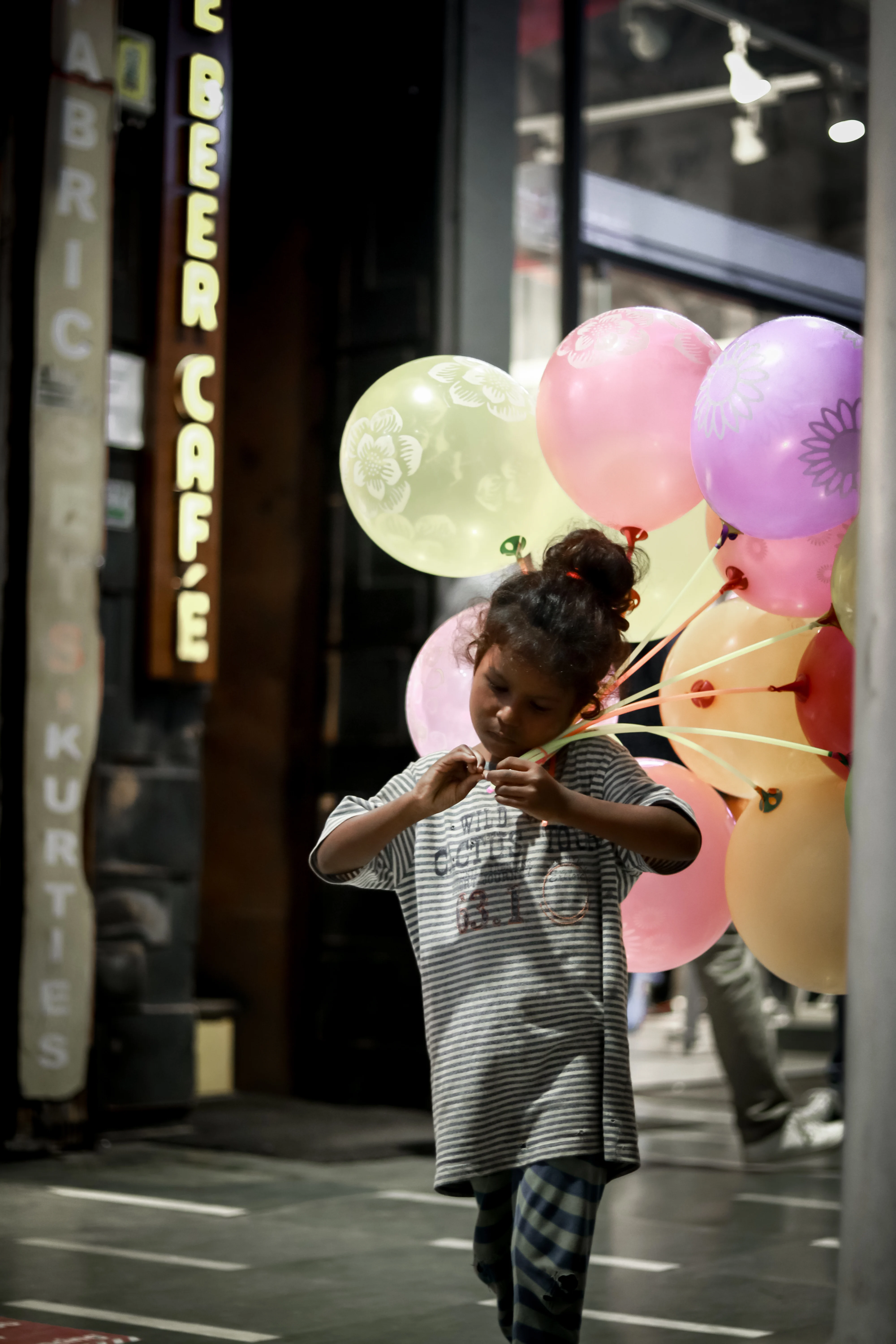 Girl walking with her balloons