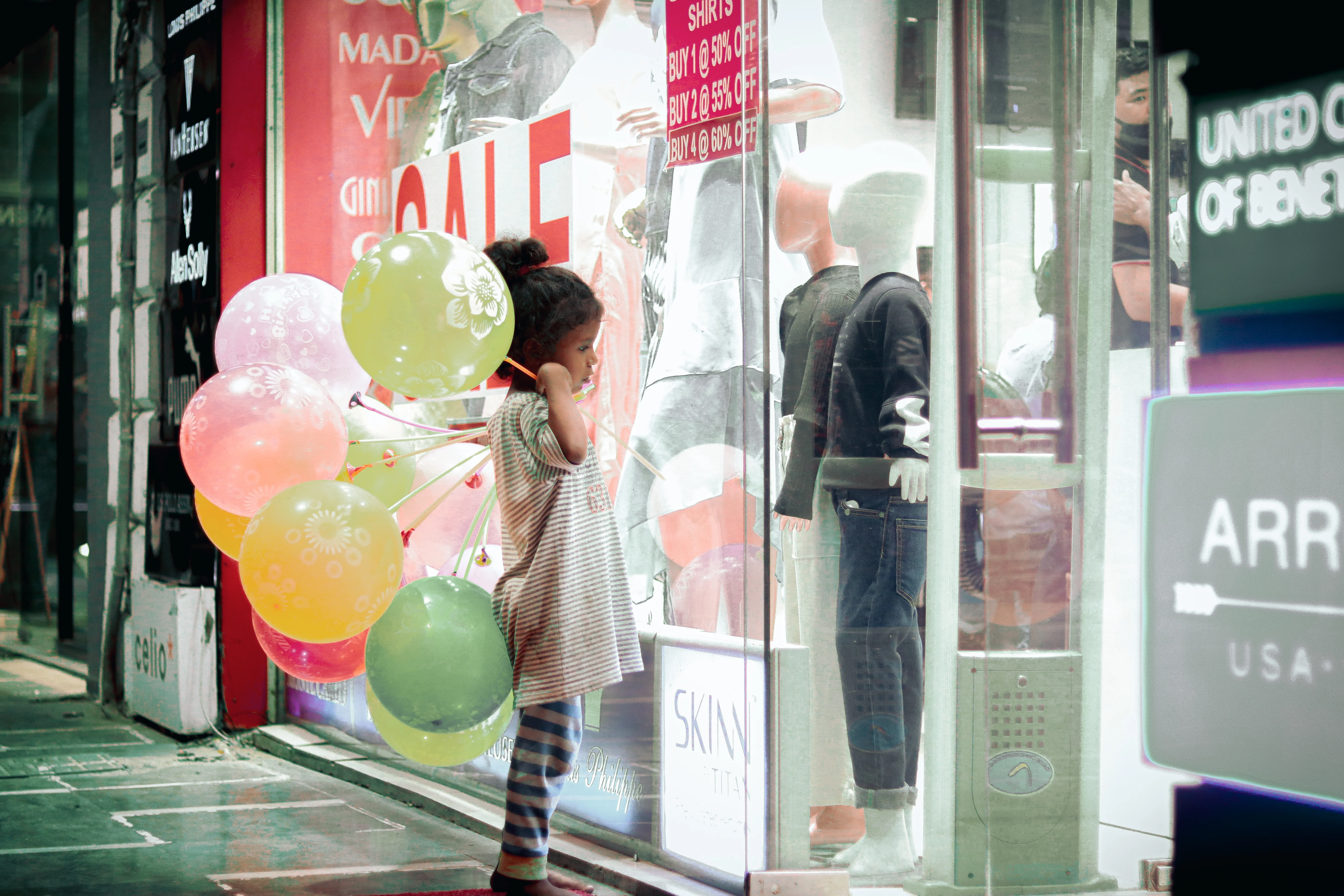 Girl looking at clothes outside a shop